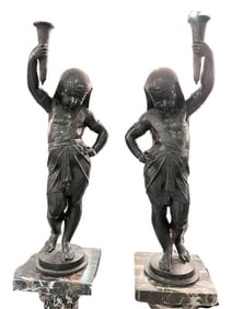 A PAIR OF FRENCH EGYPTIAN REVIVAL CAST-IRON FIGURAL TORCHERE, LAST QUARTER 19TH CENTURY