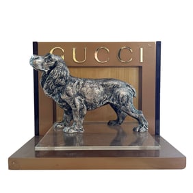 A VINTAGE SILVERED 'GUCCI' DOG, FULLY HALLMARKED