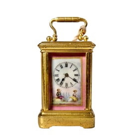 A FRENCH MINIATURE GILT-BRASS TIME PIECE CARRIAGE CLOCK