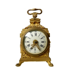 A FRENCH GILT BRONZE OFFICERS CLOCK, CIRCA 1910