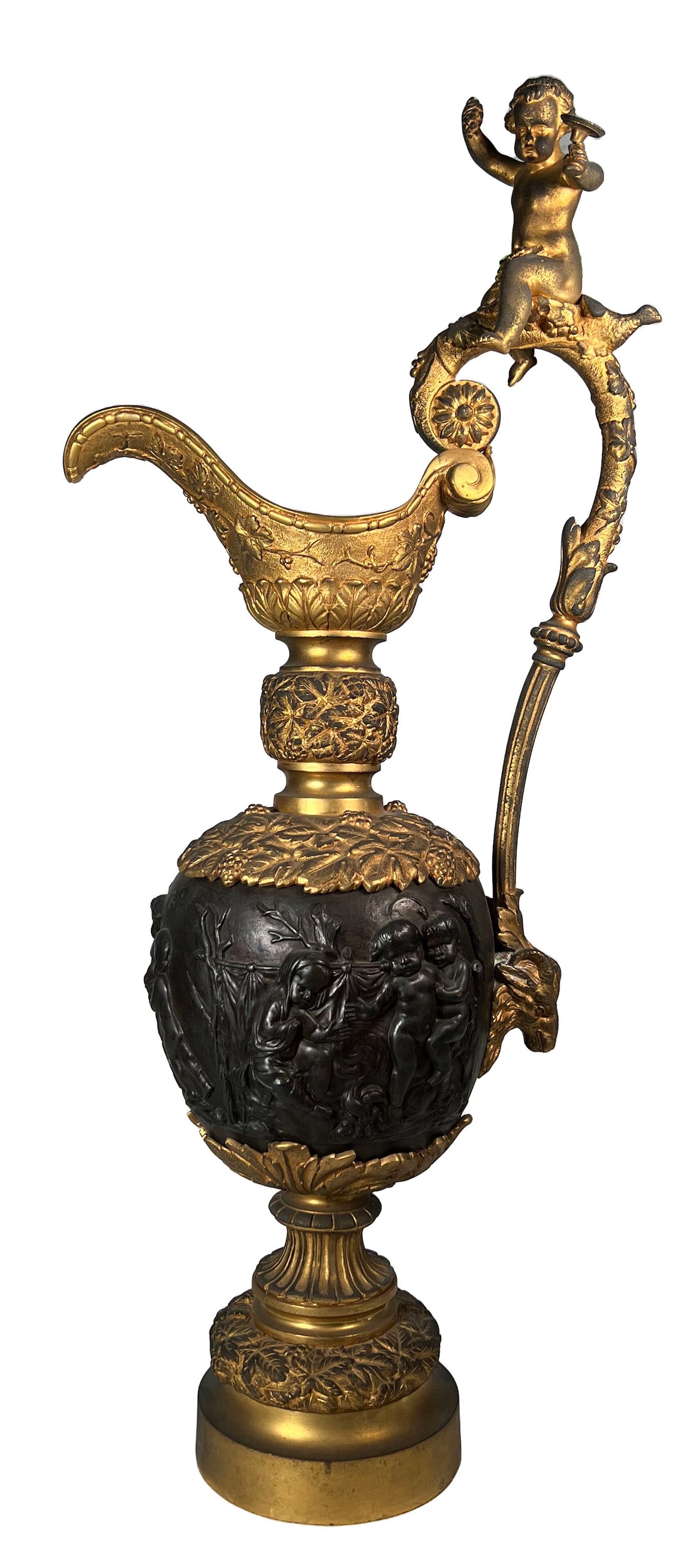 A LARGE FRENCH GILT AND PATINATED BRONZE EWER IN THE MANNER OF CLODION, CIRCA 1890: A LARGE FRENCH GILT AND PATINATED BRONZE EWER IN THE MANNER OF CLODION, CIRCA 1890 having a baluster form cast around the body with bacchic putti frolicking with dogs and goats, with averted spouts