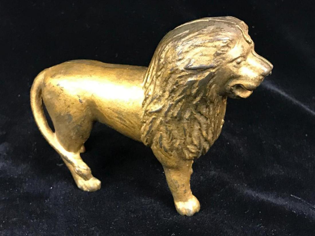 Antique still bank: Late 19th century cast iron with original gilt paint, figure of a standing lion; height 4"
