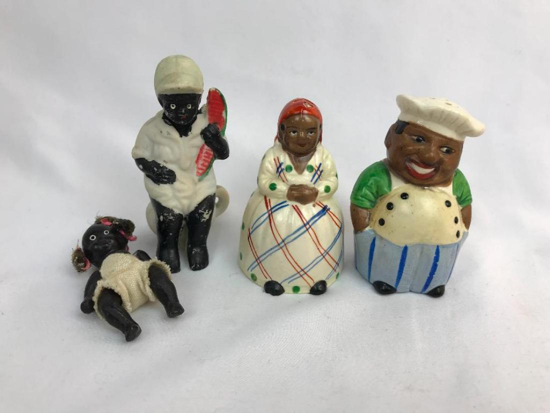4 Porcelain & Pottery Figures: Lot: Articulated five piece baby doll; Baby on pot, 3 3/4" H, Mammy & Chef shaker set