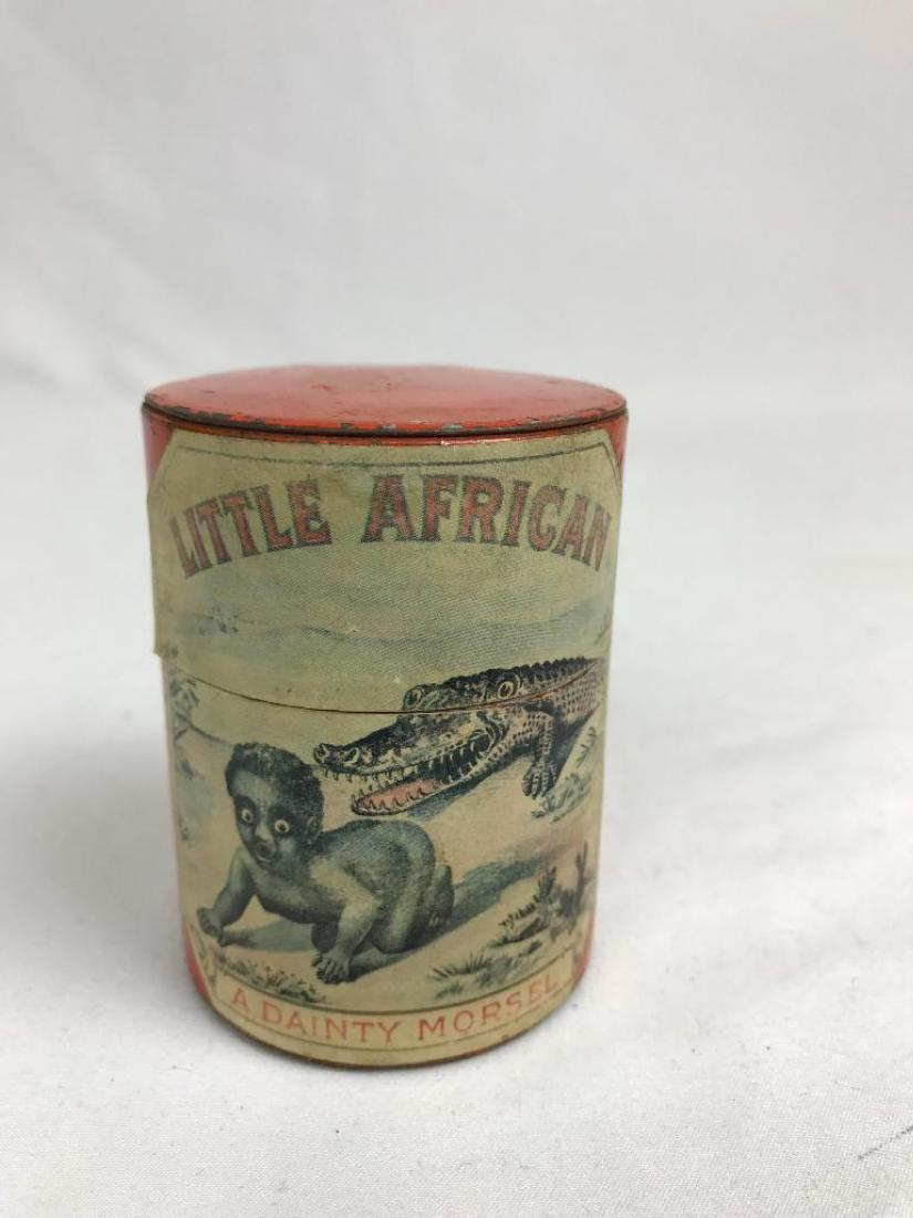 Candy Tin With Paper Label: Black Americana "Little African "A Dainty Morsel", painted tinned can with paper label for licorice drops, ca., 1900, 3" H x 2 1/4" diameter