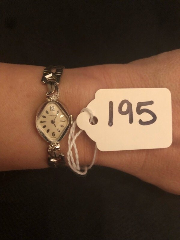Ladies Longines 14k White Gold Watch: 14 grams total weight including stainless band.*Bid with confidence*Danny's Auction will combine shipping when possible if you are bidding on multiple items. Shipping will be actual on most items. The