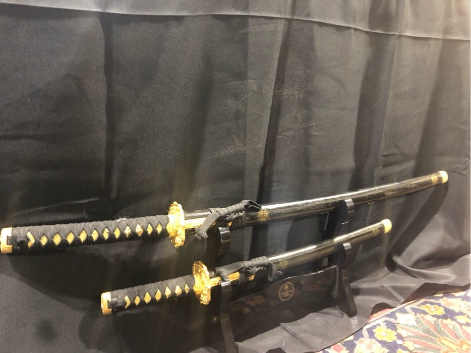 Franklin Mint Samurai Sword set: displayed only, large sward measures 48" in its sleeve and small one measures 21" in its sleeve.