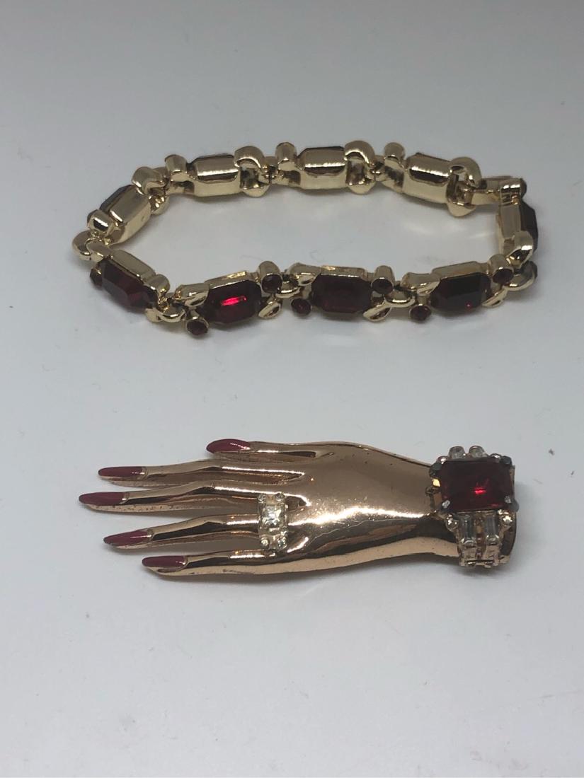 Coro Craft Hand Brooch and Lisner Bracelet Ruby Red: Sterling vermiel (gold plated over sterling) 1950's Coro-craft hand brooch pin. Gold tone with red rhinestone Lisner Bracelet (no tag, but I had these in every color)they had signed hang tags.