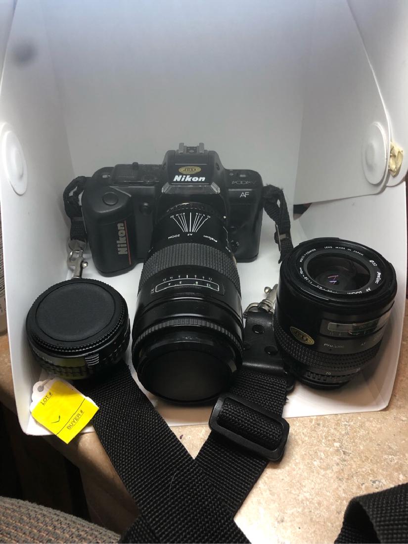 Nikon 35MM Vintage Camera Case 3 lenses N4004: Very nice camera, well cared for and always kept in its case. Comes with three nice clear lenses and flash. Other misc. items in bag like cleaner kit lense covers.