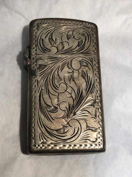 1950's Zippo Slim Vintage Engraved Lighter: Nice Patina, sparks when wheel is turned. Probably just needs fluid.