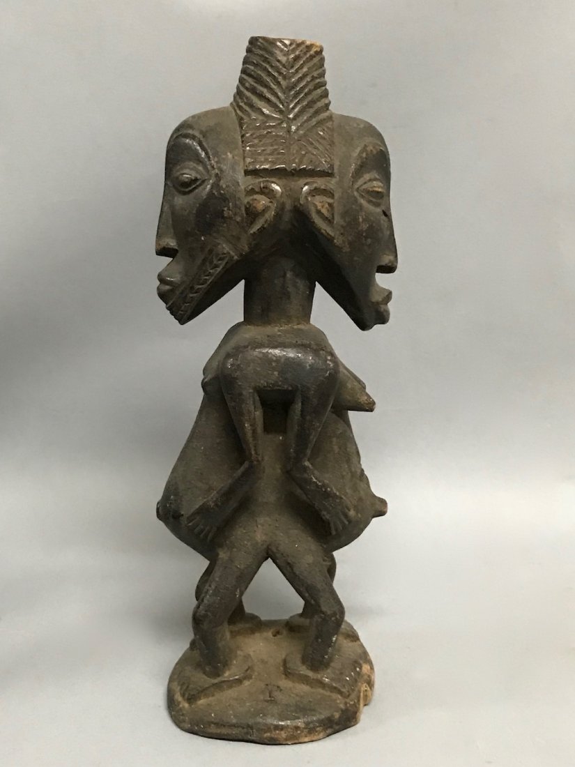 Twin Dan Statue: African Art Twin Dan Statue from Liberia. The dimension is 11.5 inches high x 3 inches wide. The shipping cost for domestic is $40.00 flat rate shipping within the Continental US, the International fo