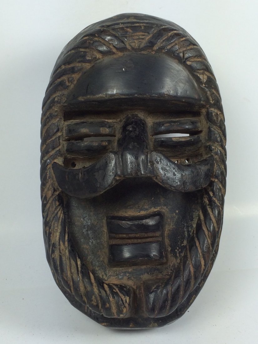Bete Mask: African Art Bete Mask is from Ivory Coast. The dimension is 10.5 inches high x 6.6 inches wide. The packing and shipping cost with insurance for domestic is $35.00 flat rate shipping within the Contin