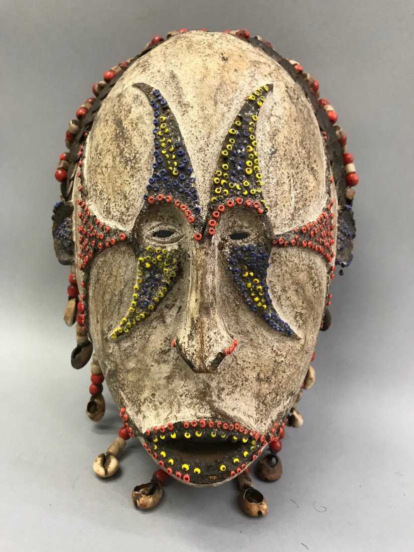 Ibo Mask: African Art Ibo Mask from Nigeria. The dimension is 10.5 inches high x 8 inches wide. The packing and shipping cost with insurance for domestic is $45.00 flat rate shipping within the Continental US, 