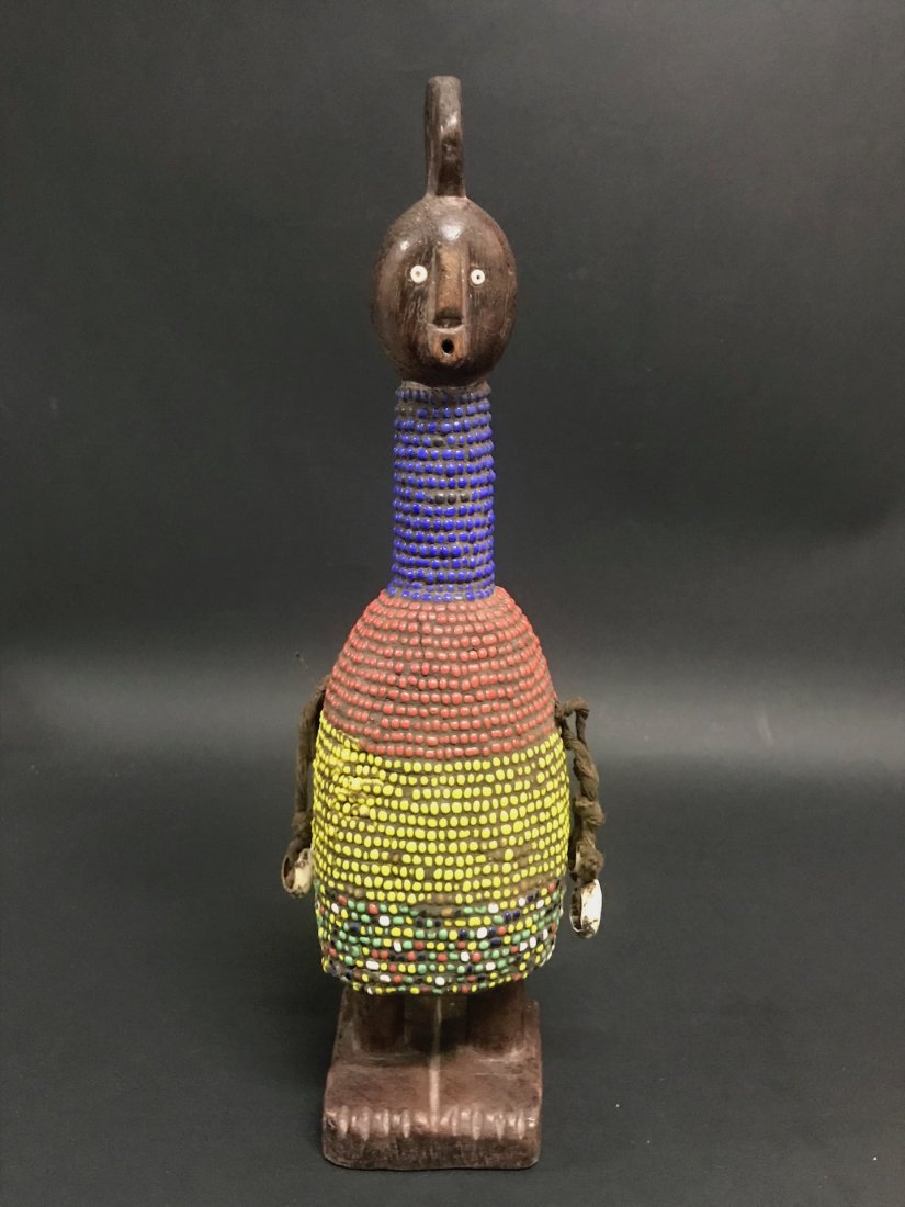 Ibeji Doll: African Art Ibeji Doll from Nigeria. The dimension 13.5 inches high x 3 inches wide. The packing and shipping cost with insurance for domestic is $30.00 flat rate shipping within the Continental US, t