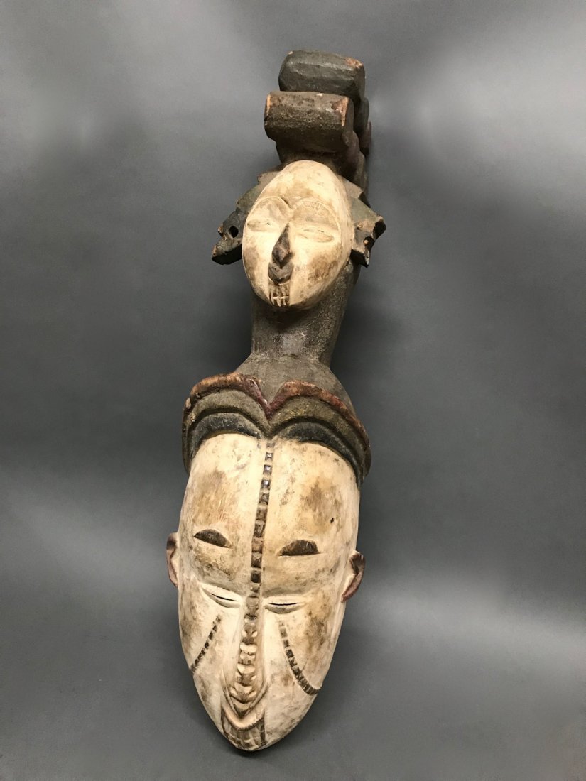 Ibo Mask: African Art Ibo Mask from Nigeria. The dimension 22.5 inches high x 6.5 inches wide. The packing and shipping cost with insurance for domestic is $45.00 flat rate shipping within the Continental US, t