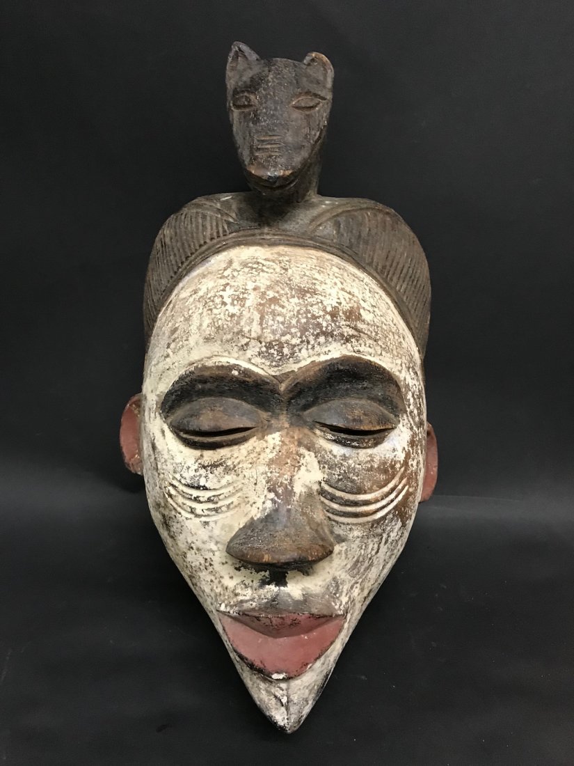 Ibo Mask: African Art Ibo Mask from Nigeria. The dimension 15 inches high x 8.5 inches wide. The packing and shipping cost with insurance for domestic is $30.00 flat rate shipping within the Continental US, the
