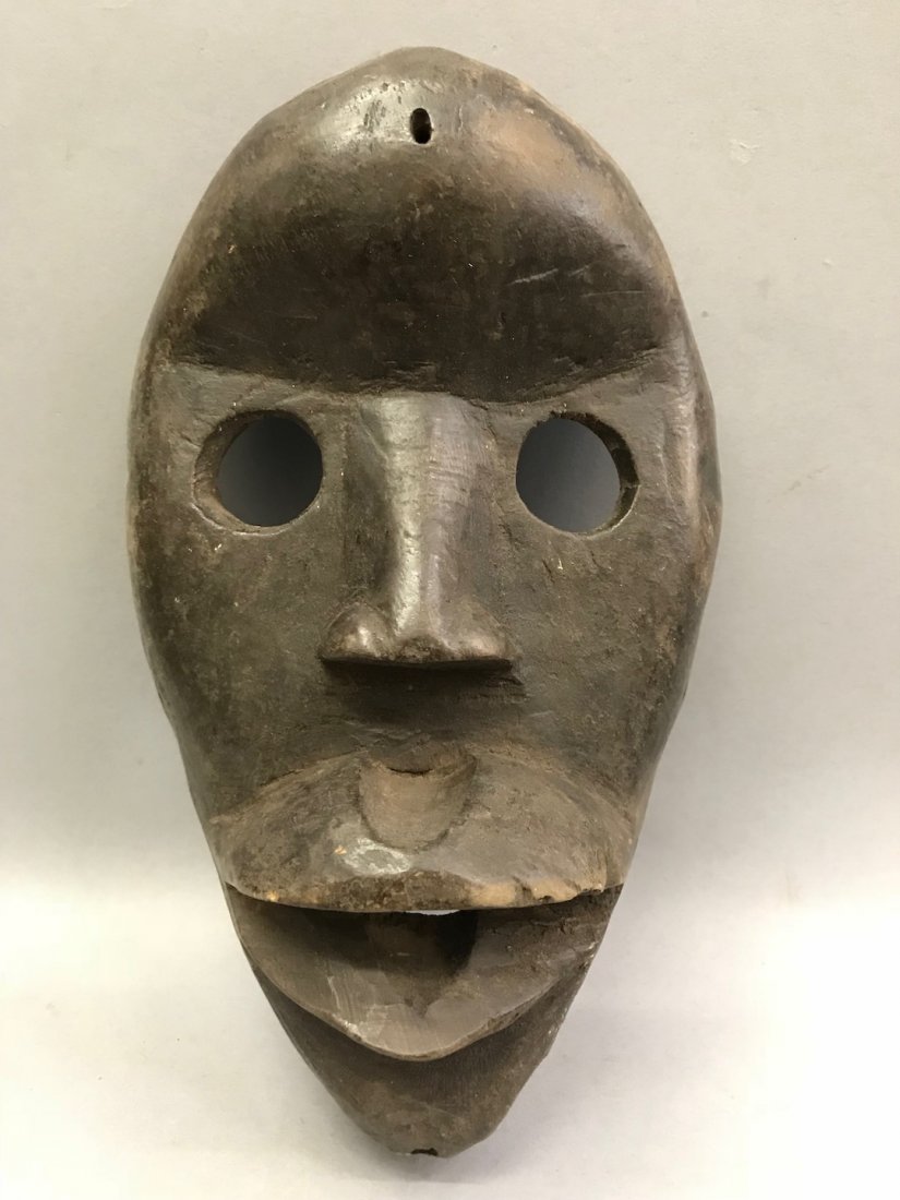 African Art Dan Mask: African Art Dan Mask. The dimension 9 inches high x 5.25 inches wide. The packing and shipping cost with insurance for domestic is $35.00 flat rate shipping within the Continental US, the Internationa