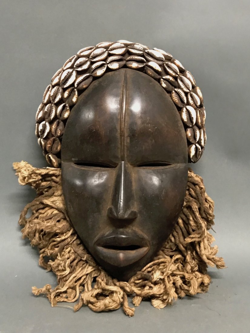 African Art Dan Mask: African Art Dan Mask. The dimension 11 inches high x 8 inches wide. The packing and shipping cost with insurance for domestic is $45.00 flat rate shipping within the Continental US, the International 