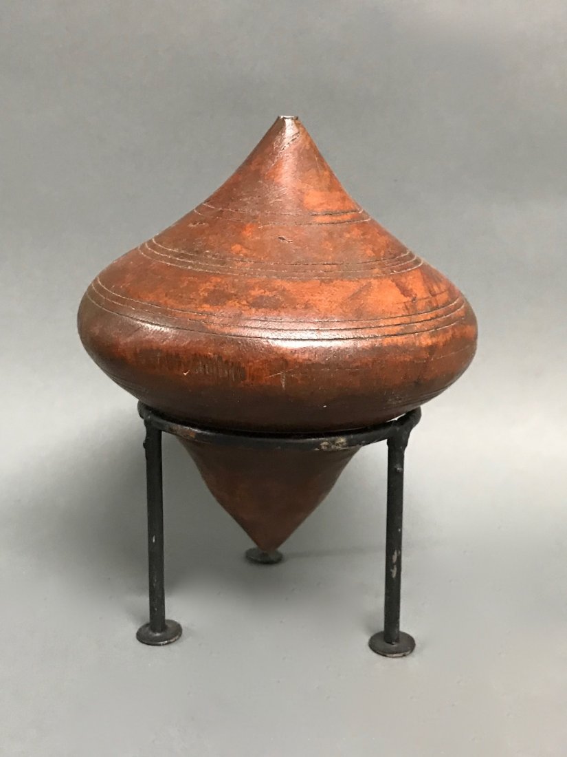Carved Wooden Toy Spinning Tops with Base: Carved Wooden Toy Spinning Tops with Base. The dimension 8 inches high x 5.25 inches wide. The packing and shipping cost with insurance for domestic is $20.00 flat rate shipping within the Continental