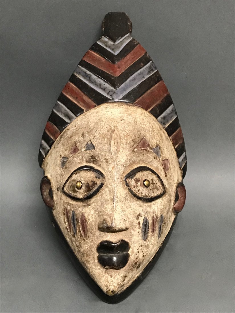African Yoruba Mask: African Tribal Art Wooden Yoruba Mask from Nigeria. The dimension is 10 inches high x 6 inches wide. The packing and shipping cost with insurance for domestic is $30.00 flat rate shipping within the C