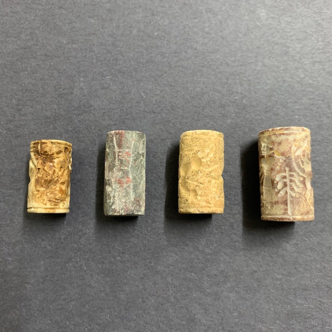 Carved Stone Sumerian Stamp Seal: Carved Stone Sumerian Stamp Seal. The dimension is 1.25 inches high x .5 inches wide. The shipping cost for domestic is $15.00 flat rate shipping within the Continental US, the International foreign s