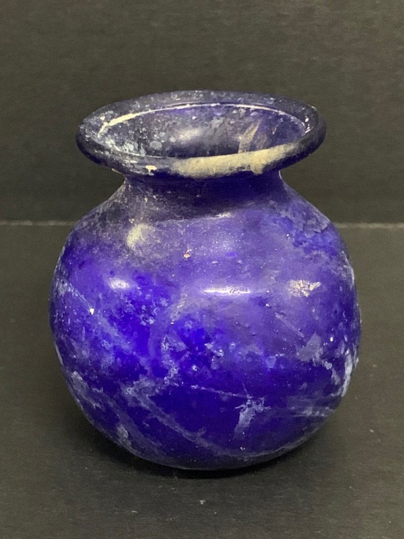 Roman Glass Bottle/Vial: Roman Glass Bottle/Vial. The dimension is 2.5 inches high x 2.25 inches wide. The shipping cost for domestic is $15.00 flat rate shipping within the Continental US, the International foreign shipping