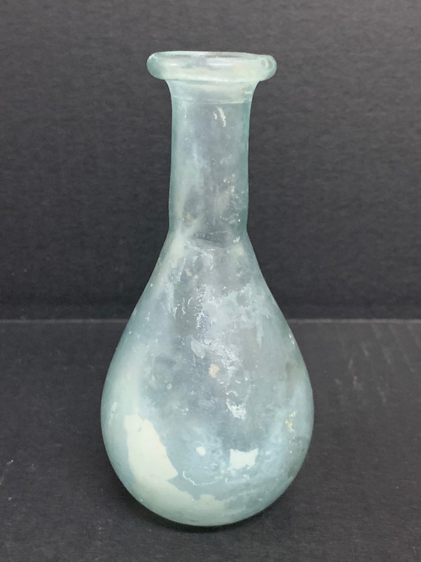 Roman Glass Bottle/Vial: Roman Glass Bottle/Vial. The dimension is 5.25 inches high x 2.5 inches wide. The shipping cost for domestic is $15.00 flat rate shipping within the Continental US, the International foreign shipping