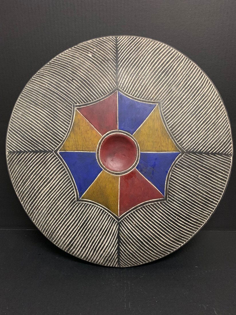 Zulu Shield: African Tribal Art Zulu Shield. The dimension is 21 inches high x 21 inches wide. The shipping cost for domestic is $55.00 flat rate shipping within the Continental US including handling, packing and