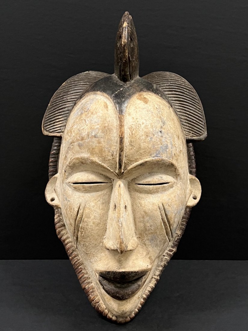 Ibo Mask: African Art Ibo Mask from Nigeria. The dimension is 14 inches high x 8 inches wide. The shipping cost for domestic is $40.00 flat rate shipping within the Continental US including handling, packing an