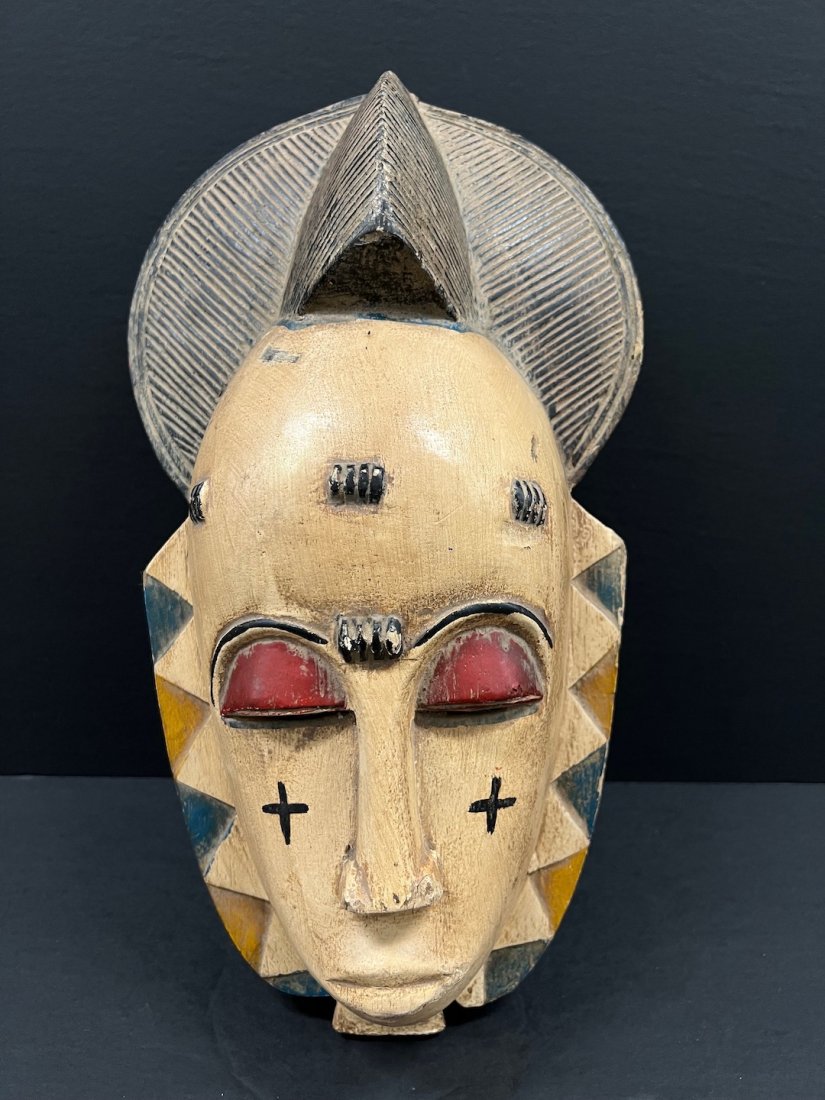 Baule Mask: African Art Baule Mask from Ivory Coast. The dimension is 16 inches high x 9.25 inches wide. The shipping cost for domestic is $40.00 flat rate shipping within the Continental US including handling, p