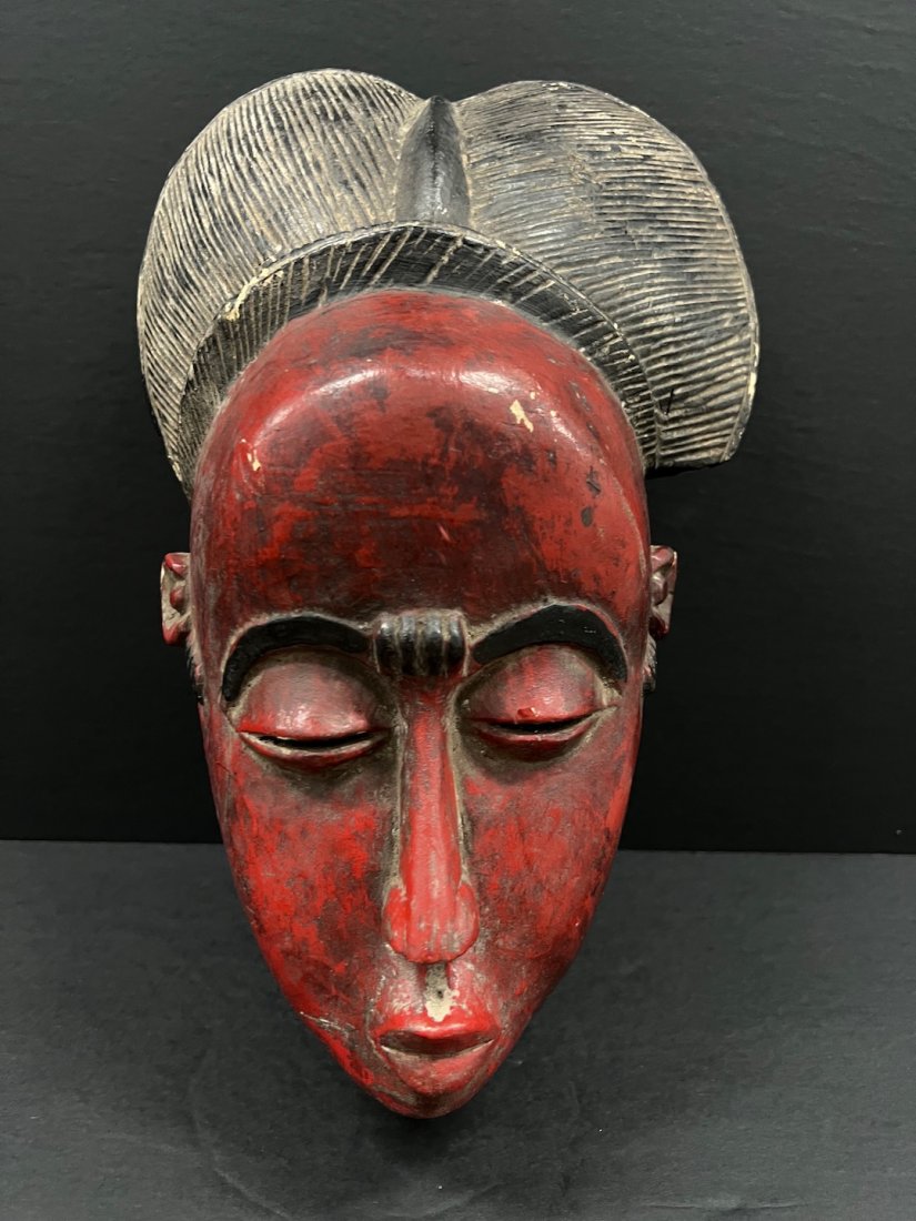 Baule Mask: African Art Baule Mask from Ivory Coast. The dimension is 15 inches high x 9 inches wide. The shipping cost for domestic is $40.00 flat rate shipping within the Continental US including handling, pack
