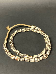 Beaded Necklace: African Tribal Art Beaded Necklace. The dimension is 30 Inches round. The shipping cost for domestic is $20.00 flat rate shipping within the Continental US including handling, packing and insurance (i