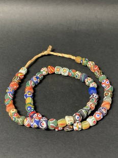 Recycled Glass Beads Necklace: African Tribal Art Recycled Glass Beads Necklace. The dimension is 28 inches Round. The shipping cost for domestic is $20.00 flat rate shipping within the Continental US including handling, packing