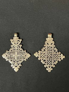 Ethiopian Metal Cross Pendant 2 Pcs.: African Tribal Art Ethiopian Metal Cross Pendant 2 Pcs.. The dimension is 2.5 inches high x 2.5 inches wide. The shipping cost for domestic is $20.00 flat rate shipping within the Continental US inclu