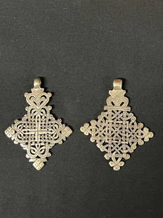 Ethiopian Metal Cross Pendant 2 Pcs.: African Tribal Art Ethiopian Metal Cross Pendant 2 Pcs.. The dimension is 2.5 inches high x 2.5 inches wide. The shipping cost for domestic is $20.00 flat rate shipping within the Continental US