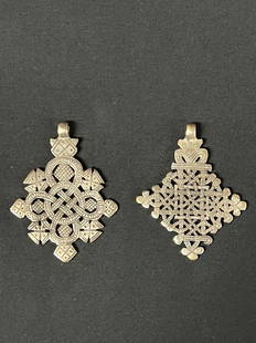 Ethiopian Metal Cross Pendant 2 Pcs.: African Tribal Art Ethiopian Metal Cross Pendant 2 Pcs.. The dimension is 2.5 inches high x 2.5 inches wide. The shipping cost for domestic is $20.00 flat rate shipping within the Continental US inclu