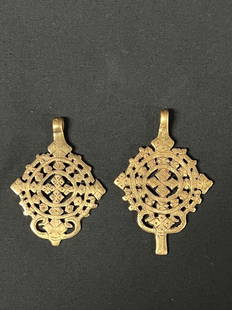 Ethiopian Metal Cross Pendant 2 Pcs.: African Tribal Art Ethiopian Metal Cross Pendant 2 Pcs.. The dimension is 3.5 inches high x 3.5 inches wide. The shipping cost for domestic is $20.00 flat rate shipping within the Continental US inclu