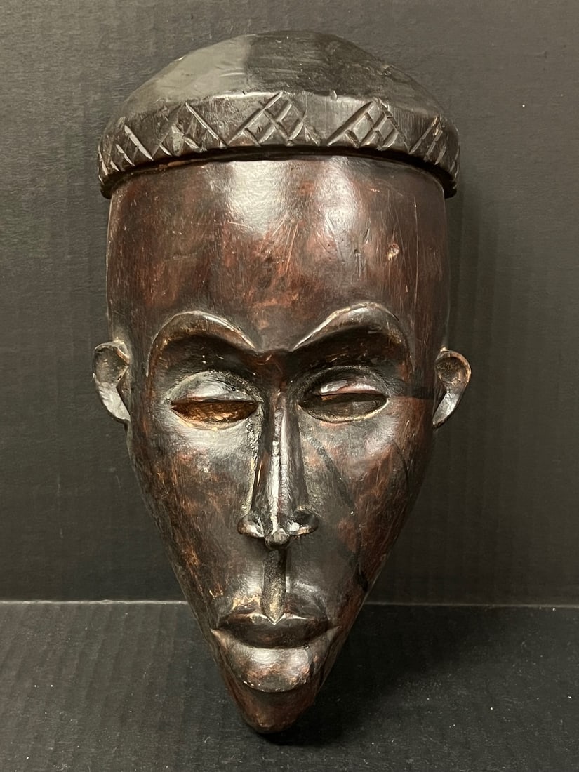 Songye Mask: African Tribal Art Dan Mask. The dimension is 11 inches high x 6 inches wide. The shipping cost for domestic is $30.00 flat rate shipping within the Continental US including handling, packing and insu