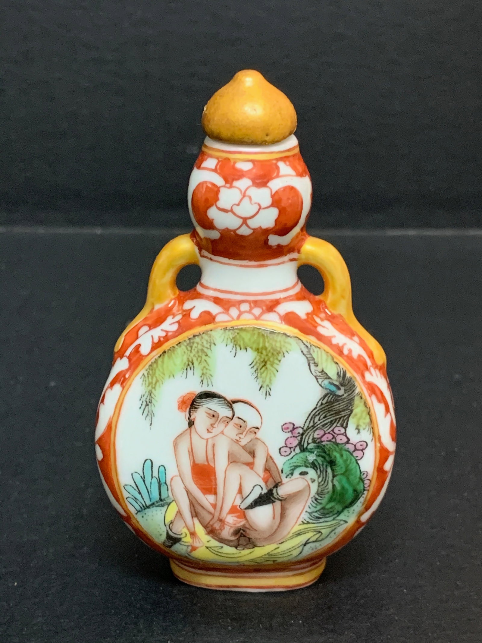Porcelain and Enamel Erotica Design Snuff Bottle: Chinese Art Porcelain and Enamel Erotica Design Snuff Bottle. The dimension is 3.5 inches high x 2.25 inches wide. Please be aware that some of the items are vintage, secondhand, old ages, antiques an