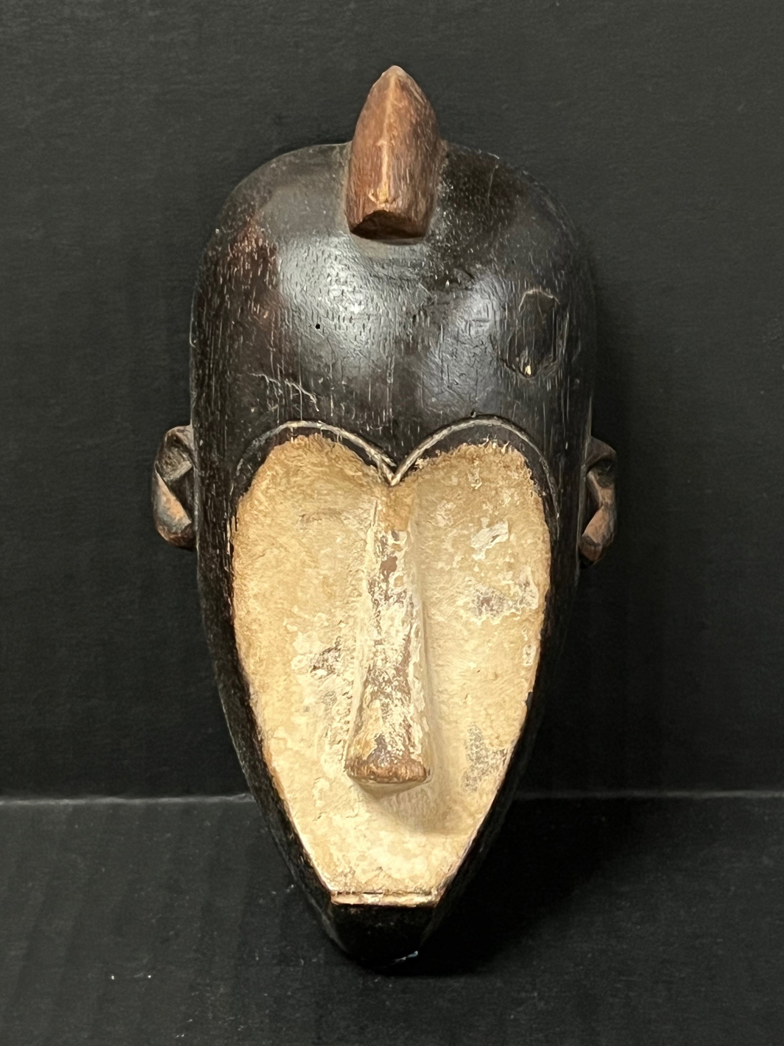 Fang Mask: African Tribal Art Fang Mask. The dimension is 6.5 inches high x 3.75 inches wide. Please be aware that some of the items are vintage, secondhand, old ages, antiques and may have a defects or sign of 