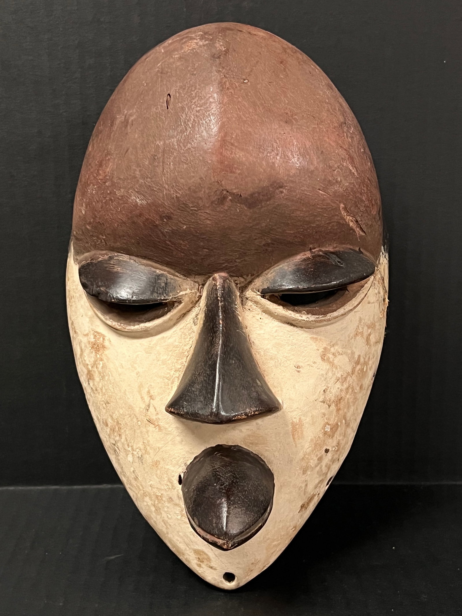 Ibo Mask: African Tribal Art Ibo Mask. The dimension is 10.5 inches high x 6.5 inches wide. Please be aware that some of the items are vintage, secondhand, old ages, antiques and may have a defects or sign of a
