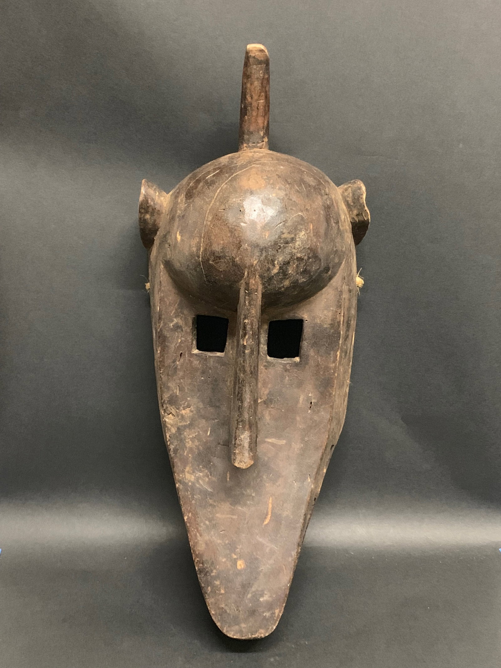 Bamana Mask: African Tribal Art Bamana Mask. The dimension is 18 inches high x 7 inches wide. Please be aware that some of the items are vintage, secondhand, old ages, antiques and may have a defects or sign of ag