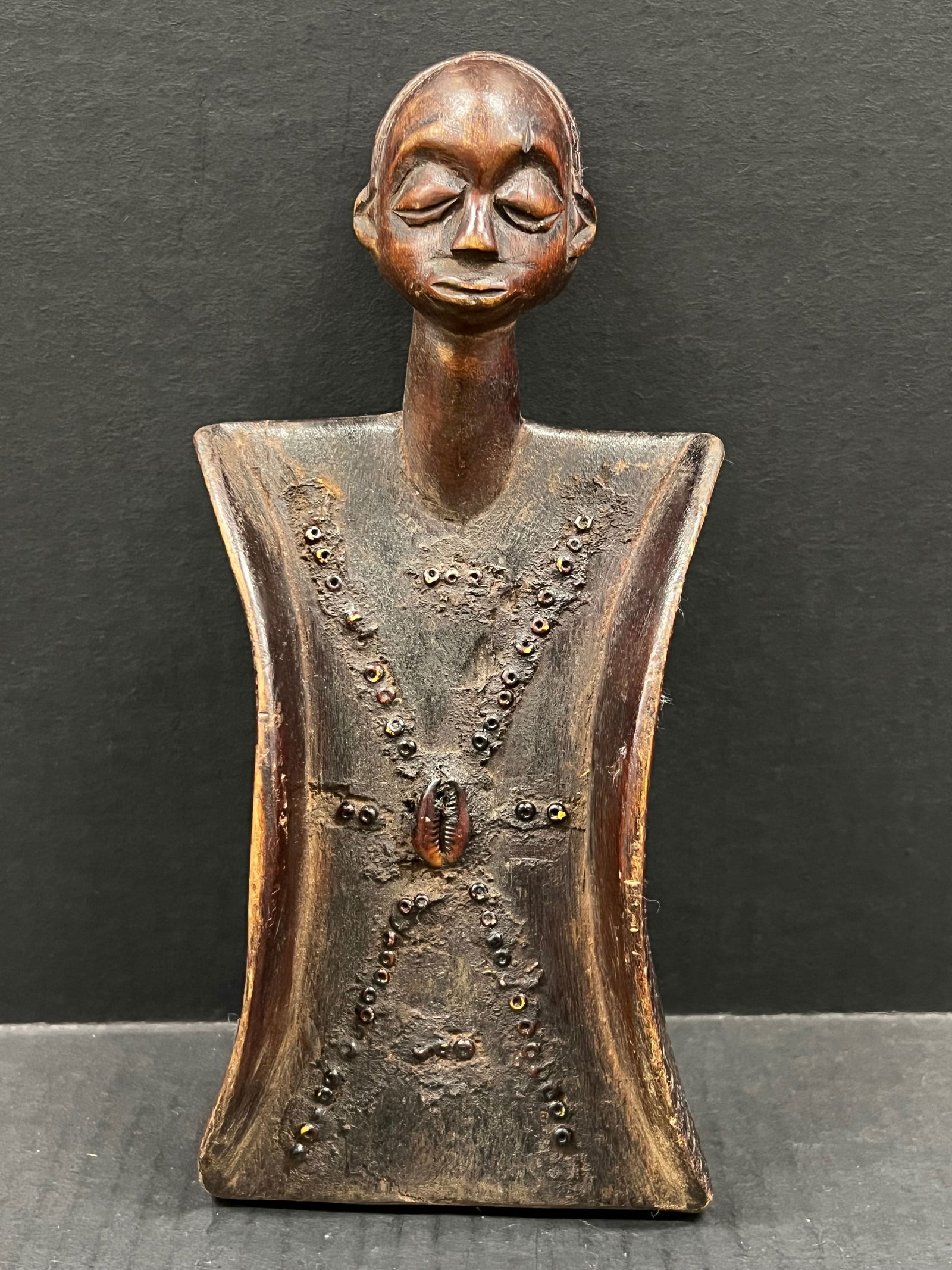 Carved Wood Luba Memory Board: African Tribal Art Carved Wood Luba Memory Board. The dimension is 10 inches high x 4.5 inches wide. Please be aware that some of the items are vintage, secondhand, old ages, antiques and may have a d