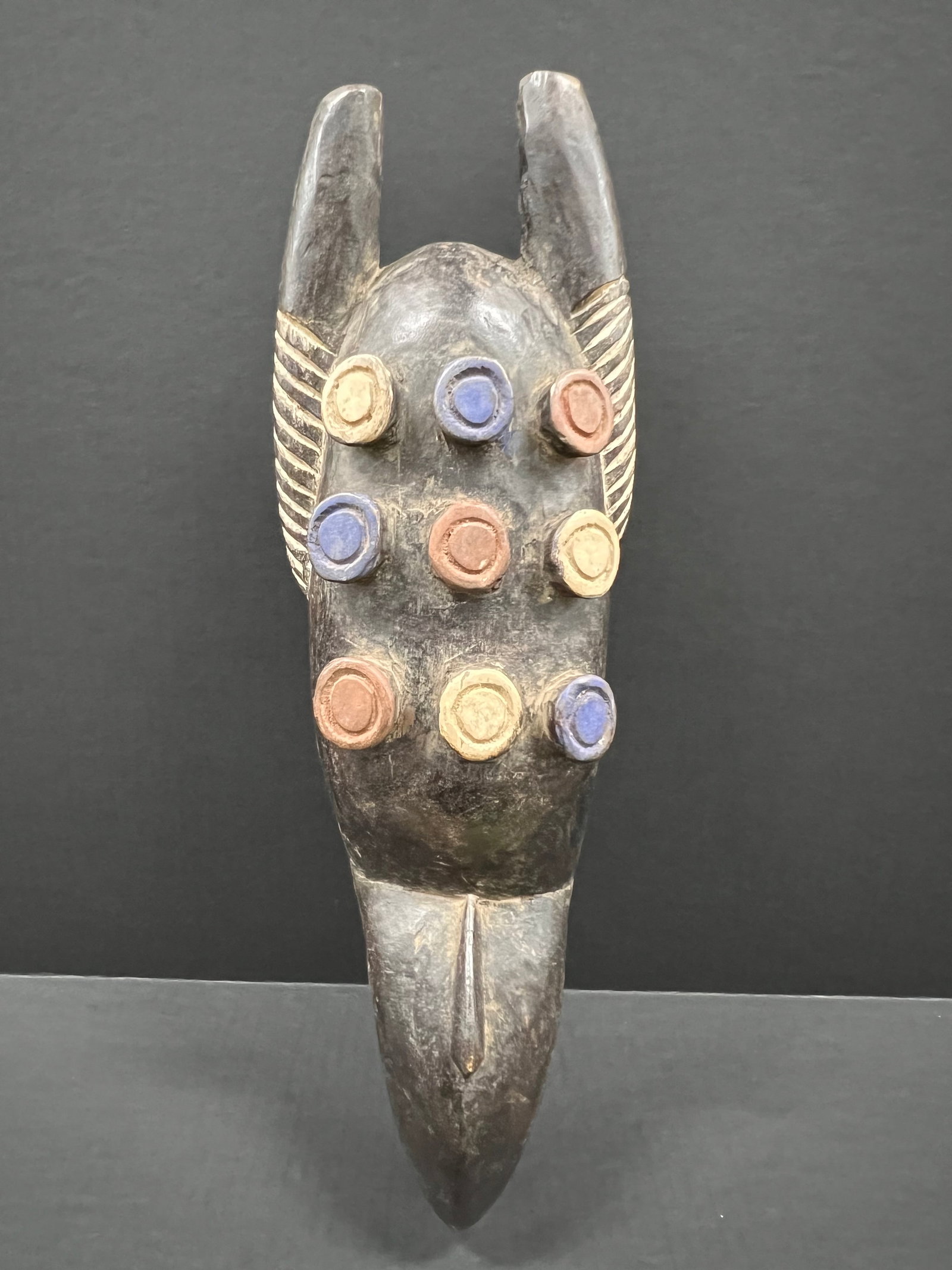 Grebo Mask: African Tribal Art Carved Wood Grebo Mask. The dimension is 19 inches high x 6.5 inches wide. Please be aware that some of the items are vintage, secondhand, old ages, antiques and may have a defects