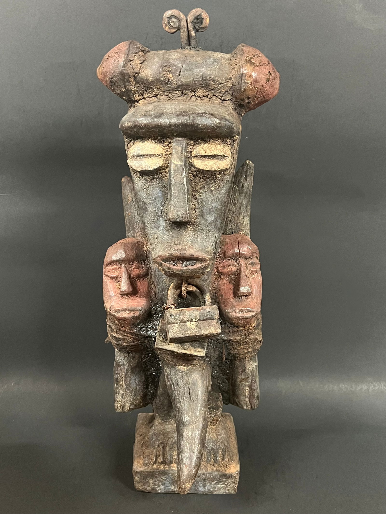 Bacongo Fetish Statue: African Tribal Art Carved Wood Bacongo Fetish Statue. The dimension is 18 inches high x 7 inches wide. Please be aware that some of the items are vintage, secondhand, old ages, antiques and may have