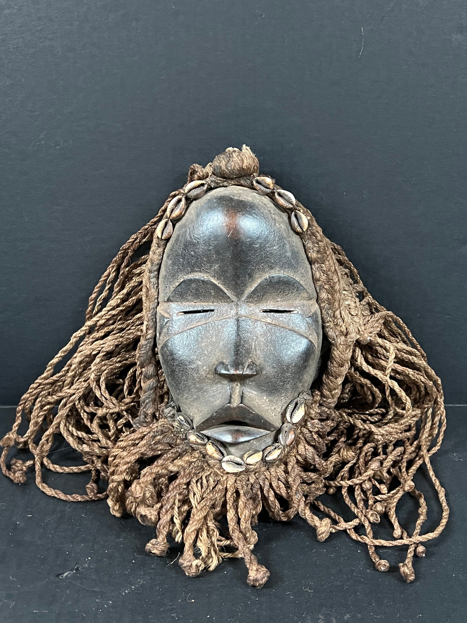 Dan Mask: African Tribal Art Carved Wood Dan Mask. The dimension is 13 inches high x 10 inches wide. Please be aware that some of the items are vintage, secondhand, old ages, antiques and may have a defects