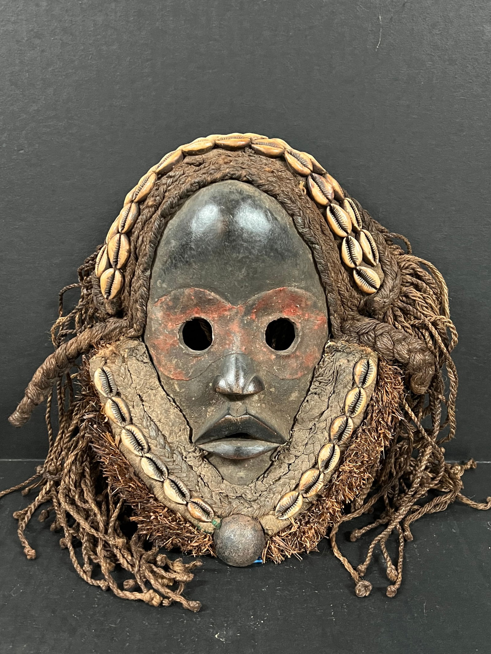 Dan Mask: African Tribal Art Carved Wood Dan Mask. The dimension is 12 inches high x 9 inches wide. Please be aware that some of the items are vintage, secondhand, old ages, antiques and may have a defects or