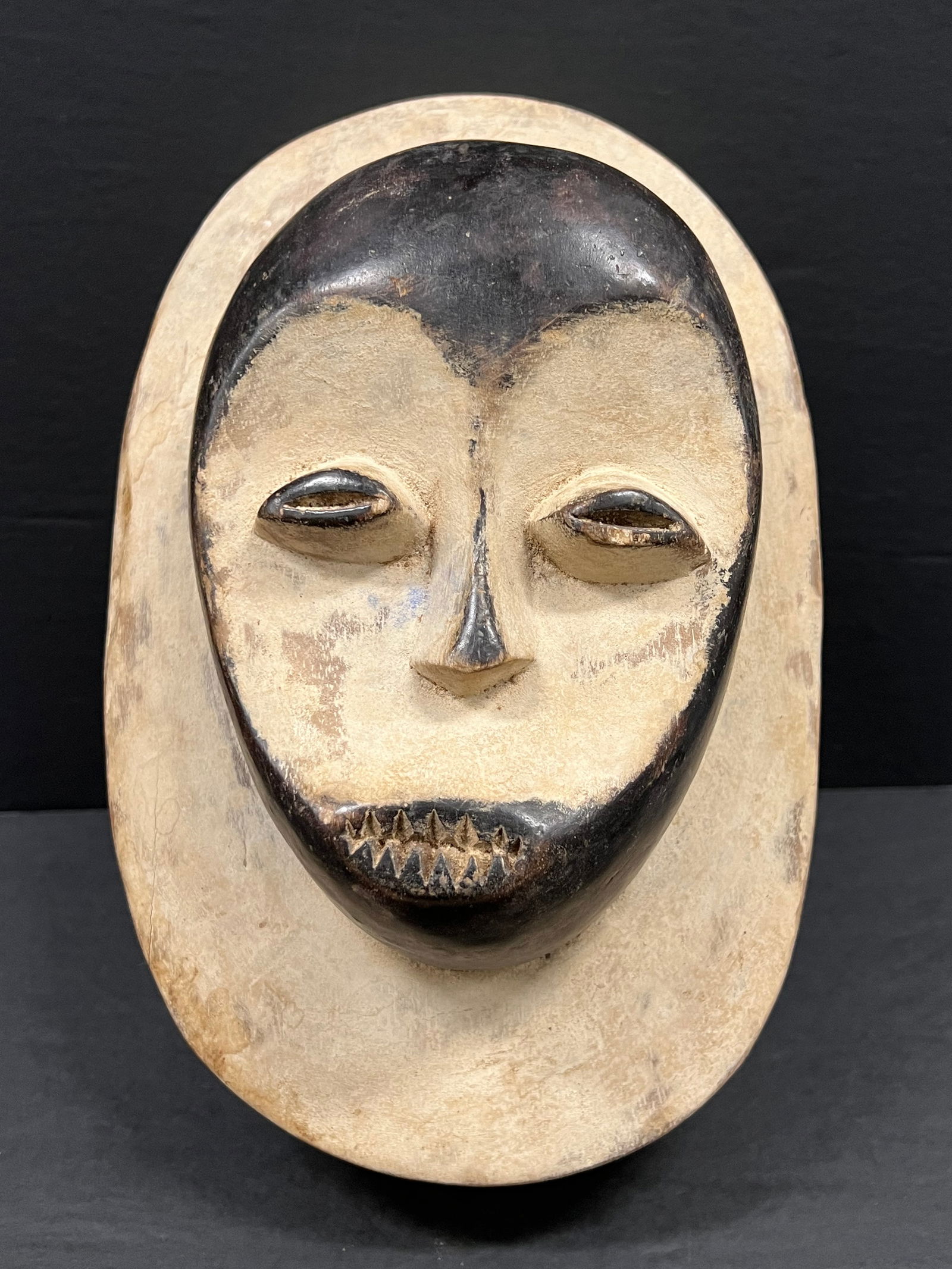Kwle Mask: African Tribal Art Carved Wood Kwele Mask. The dimension is 11 inches high x 7.5 inches wide. Please be aware that some of the items are vintage, secondhand, old ages, antiques and may have a defects