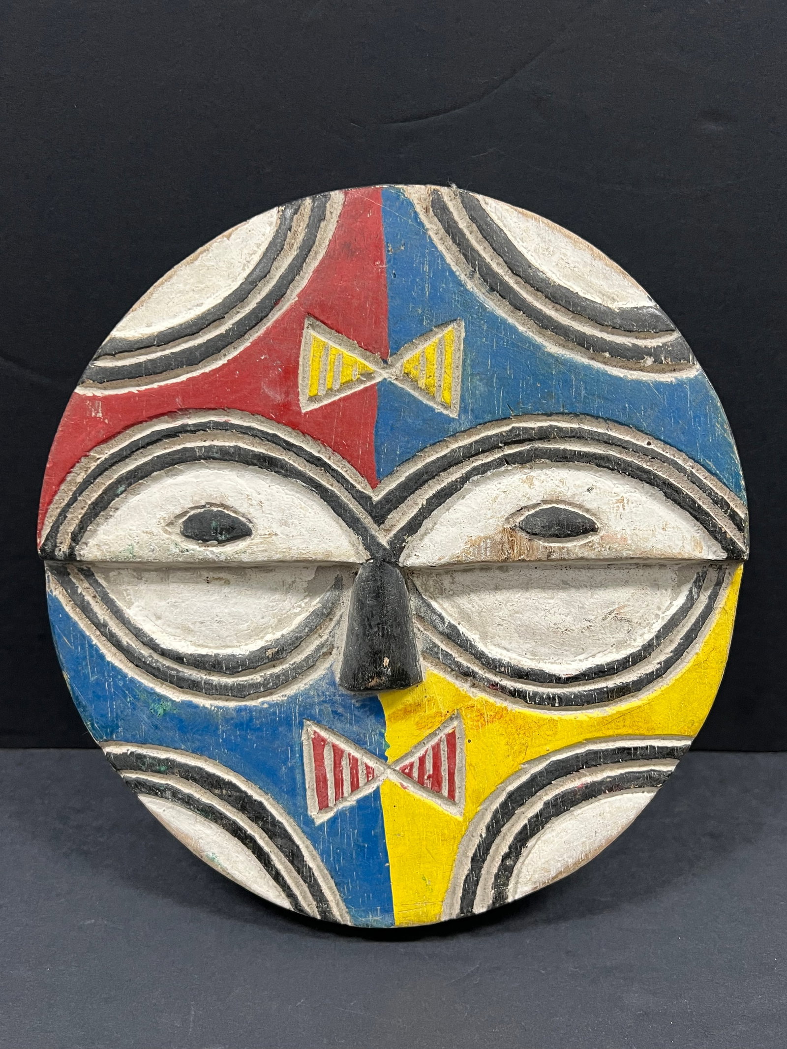 Teke Mask: African Tribal Art Carved Wood Teke Mask. The dimension is 8.5 inches high x 8.5 inches wide. Please be aware that some of the items are vintage, secondhand, old ages, antiques and may have a defects