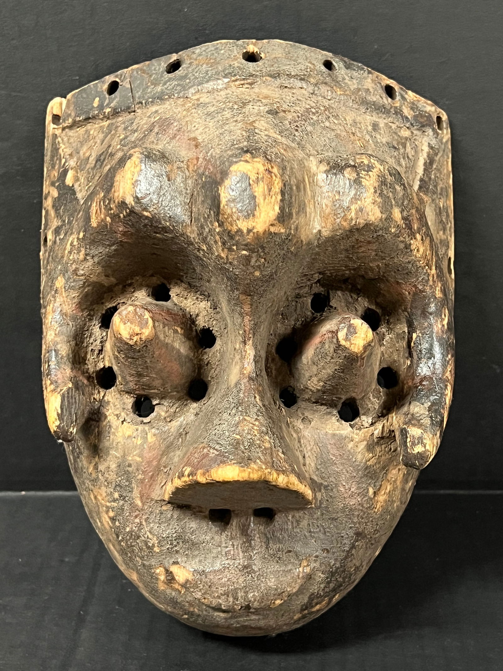 Kuba Mask: African Tribal Art Carved Wood Kuba Mask. The dimension is 7.5 inches high x 5 inches wide. Please be aware that some of the items are vintage, secondhand, old ages, antiques and may have a defects