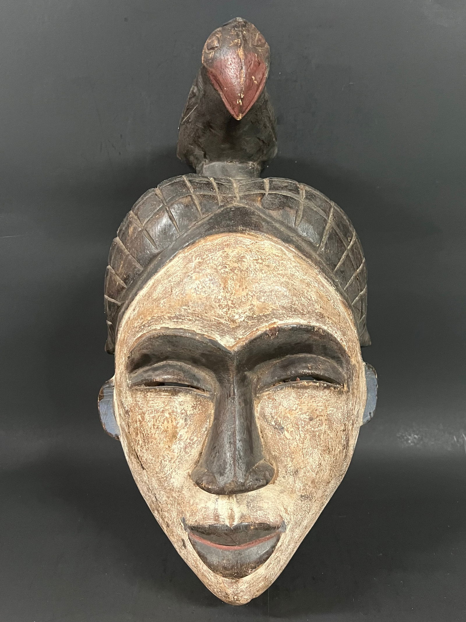 Ibo Mask: African Tribal Art Carved Wood Ibo Mask. The dimension is 16 inches high x 9.5 inches wide. Please be aware that some of the items are vintage, secondhand, old ages, antiques and may have a defects